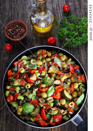 tasty Caponata with vegetables on skillet 35434543