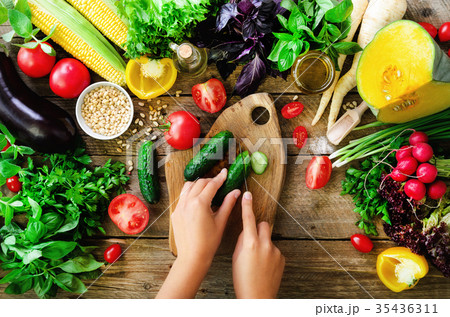 Woman hands cutting vegetables on wooden 35436311