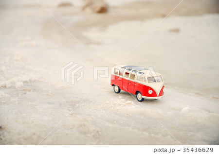 Toy car, model bus park in the sand near sea 35436629