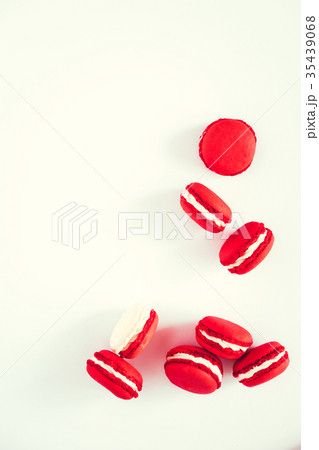 Red and white macarons on white background 35439068