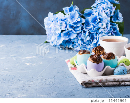 Easter sweet cup cakes treets in colorful egg Easter sweet cup cakes treets in colorful egg 35443965