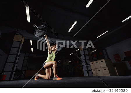 Female crossfit athlete exercising Female crossfit athlete exercising 35446529