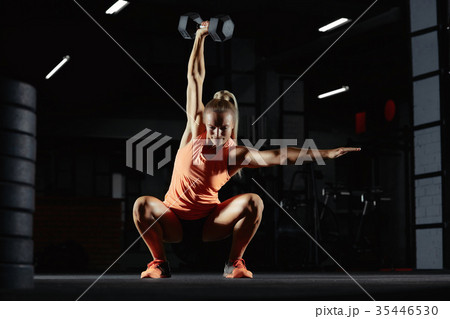 Female crossfit athlete exercising 35446530
