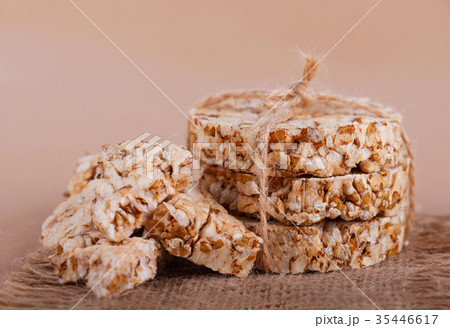 Round cereal crispbread tied with rope Round cereal crispbread tied with rope 35446617