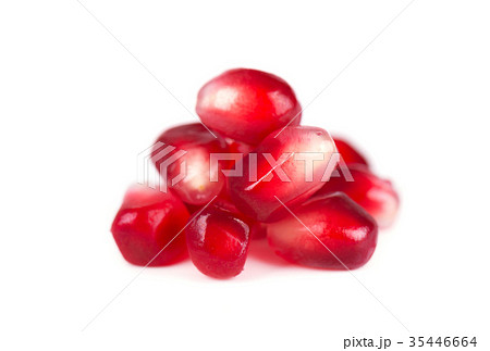 Fresh seeds of pomegranate isolated on white Fresh seeds of pomegranate isolated on white 35446664