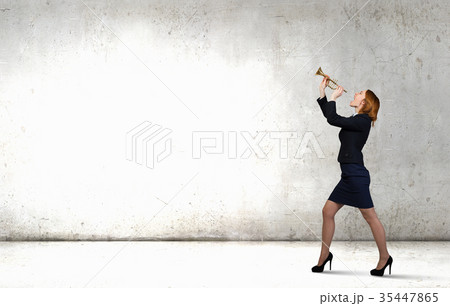 Woman speaking in horn 35447865