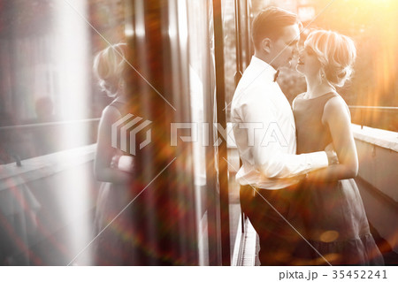 Kissing in the park the bride and groom newlyweds Kissing in the park the bride and groom newlyweds 35452241