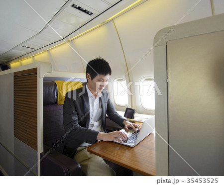 Asian man working with laptop on first class 35453525
