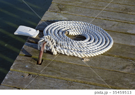 nautical mooring rope on wooden pier nautical mooring rope on wooden pier 35459513