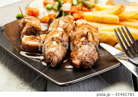 Pork rolls with french fries with vegetable Pork rolls with french fries with vegetable 35462781