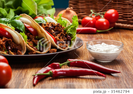 Mexican tacos with minced meat, beans and spices 35462794