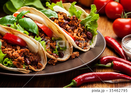 Mexican tacos with minced meat, beans and spices 35462795