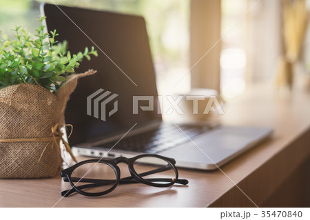 Laptop with cup of coffee in cafe 35470840