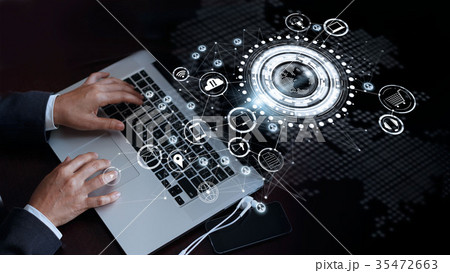 Hand touch laptop on global network , Omni Channel 35472663