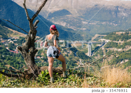 Female photographer with professional camera Female photographer with professional camera 35476931