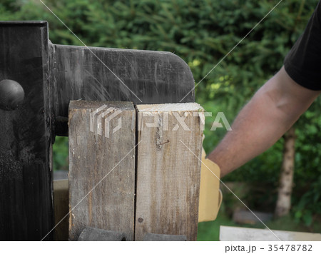 Firewood split with wooden splitter Firewood split with wooden splitter 35478782