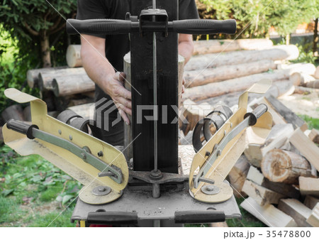 Firewood split with wooden splitter Firewood split with wooden splitter 35478800