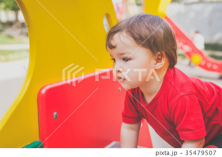 cute child playing on playground 35479507