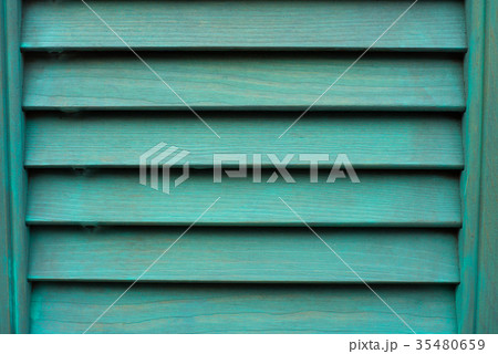 Cyan window with wooden shutter. Cyan window with wooden shutter. 35480659