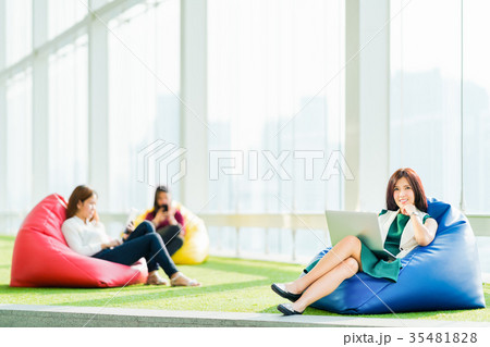 Asian women using laptop, tablet, and smartphone 35481828