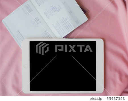 account book and tablet 35487398