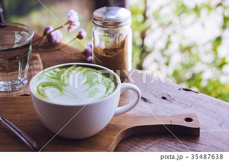 green tea hot drink latte white cup on wood table green tea hot drink latte white cup on wood table 35487638