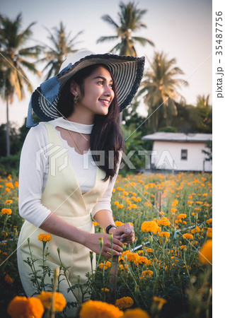 beatiful woman asia style on yellow flower garden  35487756