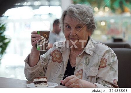 Portrait of old smiling woman in the cafe 35488363