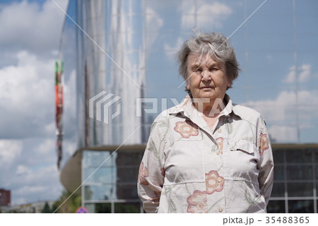 Portrait of serious old woman aged 80s outdoors Portrait of serious old woman aged 80s outdoors 35488365