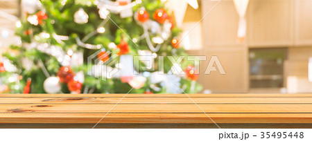 Wooden board table top blur christmas tree. 35495448