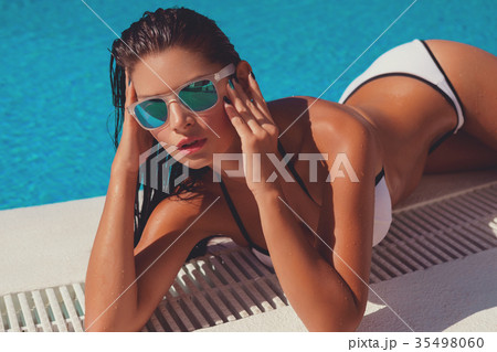 Beautiful girl in outdoor pool Beautiful girl in outdoor pool 35498060