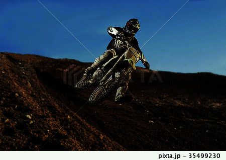 Motocross driver on race track Motocross driver on race track 35499230