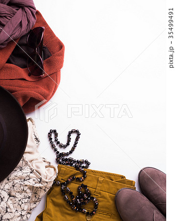 Flat lay with woman's autumn clothes, glasses hat 35499491