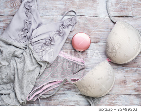 Gray woman lingerie set on wooden background Gray woman lingerie set on wooden background 35499503