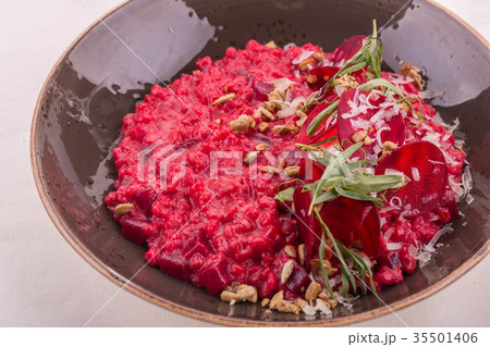 Orzotto with pine nuts and goat cheese, is served  35501406