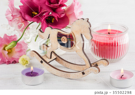 Pink red eustoma flowers and rocking horse 35502298