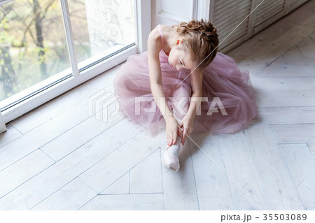 young ballet-dancer sitting on the floor 35503089