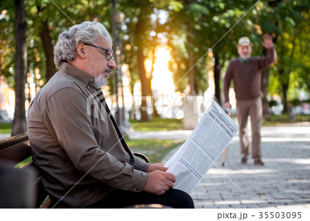 Pensive pensioner is interested in news Pensive pensioner is interested in news 35503095