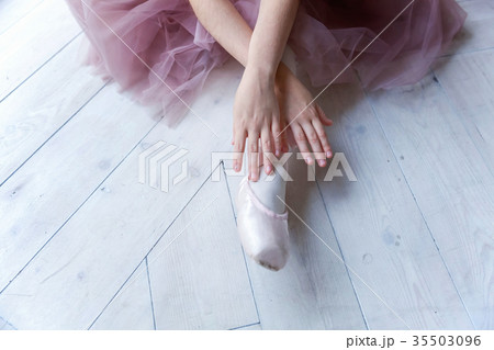 young ballet-dancer sitting on the floor young ballet-dancer sitting on the floor 35503096