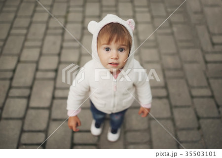 cute little girl in hood with ears cute little girl in hood with ears 35503101