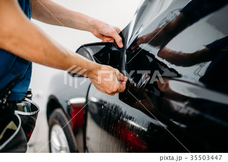 Specialist work with car, tinting film installing Specialist work with car, tinting film installing 35503447