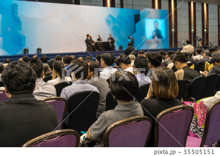 Speakers on the stage with Rear view of Audience in the conference hall or seminar meeting, business and education about investment concept 35505151