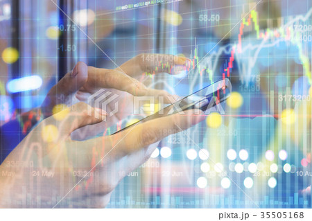 Double exposure of Closeup woman using the smart mobile phone over the soft screen of stock market background, business trading concept Double exposure of Closeup woman using the smart mobile phone over the soft screen of stock market background, business trading concept 35505168