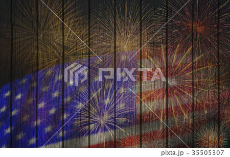 Multicolor Fireworks Celebrate over the United state of America USA flag on the wooden background, Independence day concept 35505307