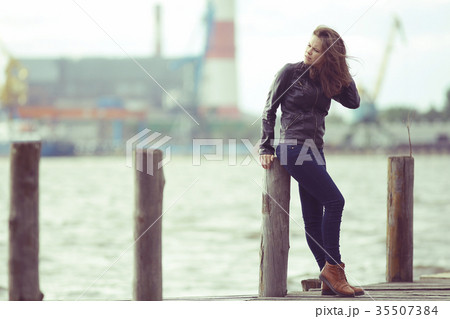 Autumn portrait of a beautiful urban girl adult wind weather climate 35507384