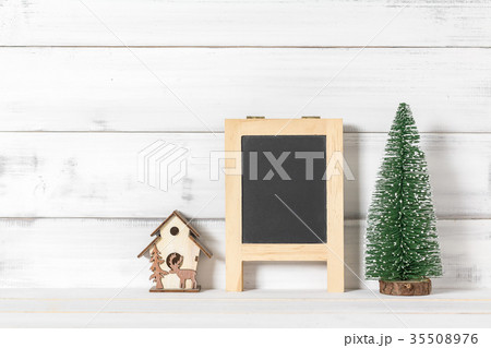 Blackboard and home ornament with christmas tree Blackboard and home ornament with christmas tree 35508976