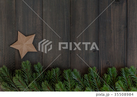 Christmas fir tree branches and paper star Christmas fir tree branches and paper star 35508984