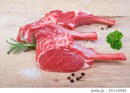 Fresh lamb cutlet on wooden background Fresh lamb cutlet on wooden background 35510085