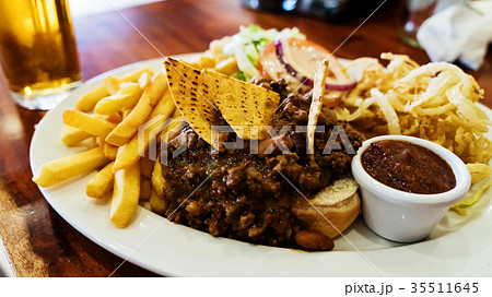 Unhealthy meal with mexican nacho chips loaded Unhealthy meal with mexican nacho chips loaded 35511645