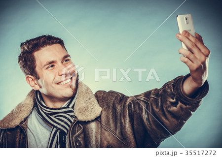 Happy half shaved man taking selfie self photo. 35517272
